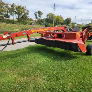 Red New Holland 1432 Disc Mower at the Bryan's Auction Puslinch location